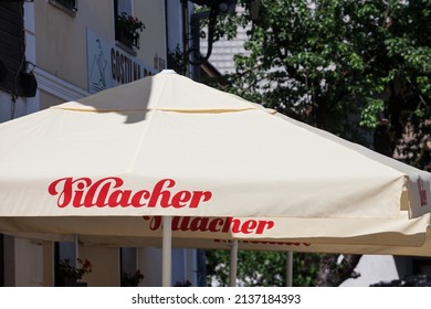 VILLACH, AUSTRIA - JUNE 13, 2021: Logo of Villacher Bier on a local bar in Villach, Austria. Villacher bier brauhof is an iconic Austrian beer producer in the Carinthia brewery of Villach.