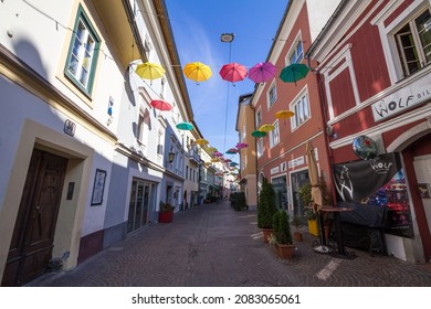 VILLACH, AUSTRIA - SEPTEMBER 13, 2021: Empty pedestrian street of ledergasse in Villach, surrounded with closed bars, restaurants and catering facilities. Villach is a city of Carinthia. 