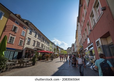 VILLACH, AUSTRIA - SEPTEMBER 13, 2021:Crowd of people on the pedestrian street of hauptplatz in Villach, surrounded with shops, stores, in summer. Villach is a city of Carinthia. 