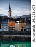 Villach, Austria. View on chrch and background high mountains.