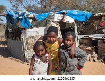 Village African Family Portrait Of Three Loving Sisters In The Yard At Sunset