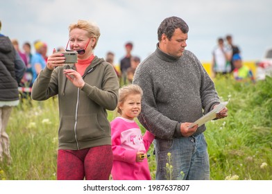 Village Of Aktovo, Ukraine - May 21, 2021: Orienteering Race. Traditional Annual Orienteering Game Partisan Spark Cup 2021. A Friendly Family During Orienteering Trail