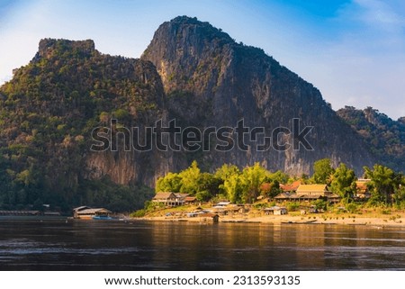 Village along the Mekong River  Laos Mekong river at sunset