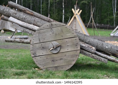  Village And An Ancient Wooden Wheel Barrow Loaded With Logs