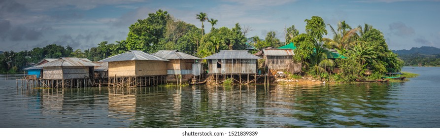Village in Bangladesh built on wooden piles as it is sinking and submerging as the water levels in this south east Asian country are rising due to climate change and global warming