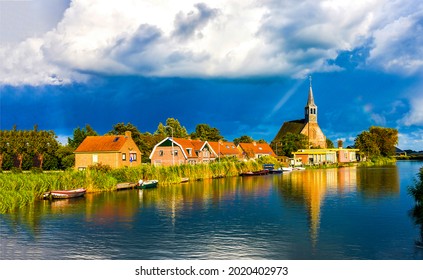 Village by the river on a cloudy day. Village river view. River village