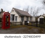Village community bringing together the old and the new. Telephone exchange building and an historic Red Telephone box now converted in a defibrillator station  next to the local Village Hall. 