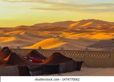 Village In The Deserts. Nomads In Morocco Desert. Tent Houses In Desert. Rising Sun.