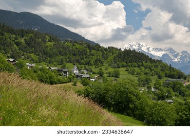 The village of Feissons sur Salins, located above the commune Bozel, Northern French Alps, Tarentaise, Savoie, France, with the Grand Bec summit in the background