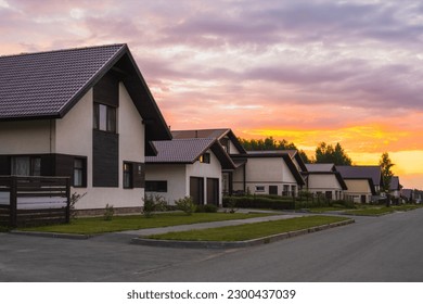 Village houses at sunset in summer. Beautiful view - Shutterstock ID 2300437039