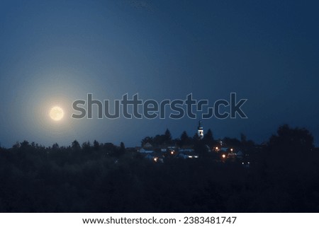 Village and Moon at night. Night scenery. Blue cool tone.