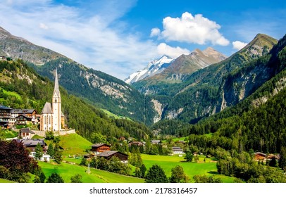 Village in the mountain valley of the Alps. Alpine mountain village. Mountain village in Alps. Mountain village landscape