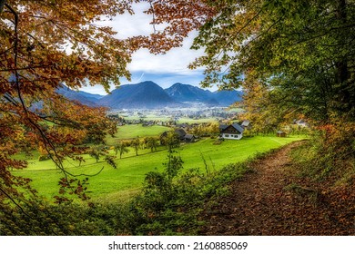 A village in a mountain valley in autumn. Mountain valley village in autumn. Autumn mountain valley village. Valley village in autumn mountains