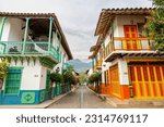 village in the mountains of colombia with traditional colonial houses of different colors, village with spanish roots