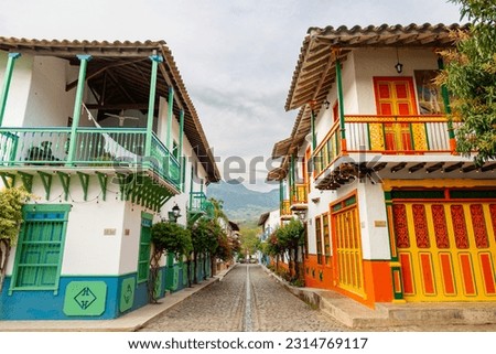 village in the mountains of colombia with traditional colonial houses of different colors, village with spanish roots