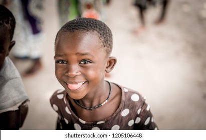 Village Near Malindi, Kenya - August 2018: Poor African Children Smiling And Happy To See Tourists.