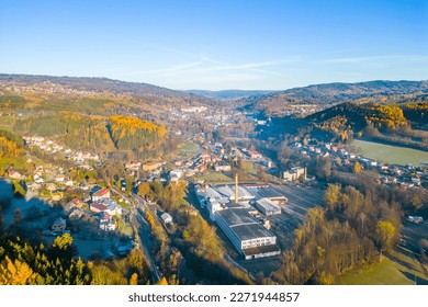 The village of Plavy situated in a sunny autumn hilly landscape, Czech Republic. Aerial view from a drone.