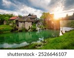 Village of Rastoke near Slunj in Croatia, old water mills on waterfalls of Korana river, beautiful countryside landscape. Landscape with river and little waterfalls in Rastoke village, Croatia.