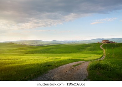 village in tuscany; Italy countryside landscape with Tuscany rolling hills ; sunset over the farm land and country road - Powered by Shutterstock