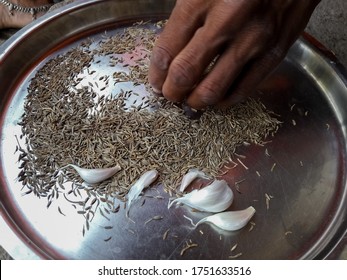 A Village Woman Is Cleaning Cumin