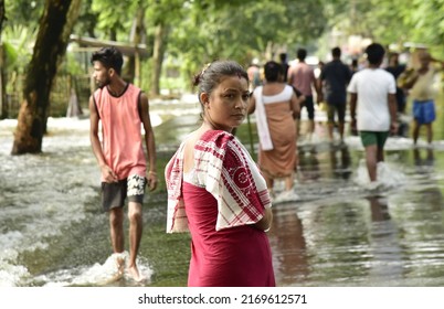 Villagers Wades Through The Flooded Street    In Kamrup District Of Assam India On Monday 20th June 2022.