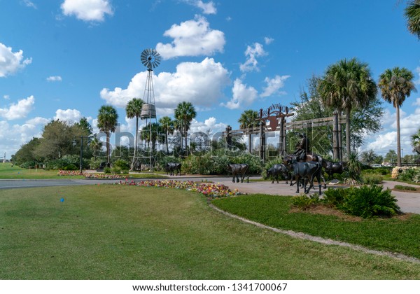  The\
Villages, Wildwood, Florida USA February 17,2019 Brownwood entrance\
with beautiful bronze statues. Brownwood has the look of Old\
Florida and is a 55 Plus retirement community.\
