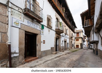 Villanueva De La Vera, Spain - March 08, 2021: A Street With A Traditional And Old Apothecary Or Pharmacy With A Ceramic Tile At The Entrance Showing The Symbol Or Emblem Of The Specialty, The Snake