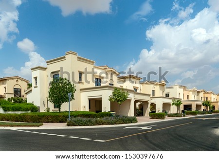 Villas compound development in a bright sunny day with white clouds in the blu sky