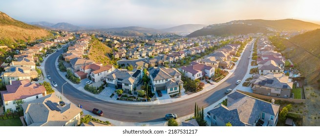 Villas in a upper middle class neighborhood around Double Peak in San Marcos, California. Aerial view of large residential buildings and curved concrete road. - Shutterstock ID 2187531217