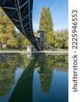 Villette Canal. Reflections on the Ourcq canal of a bridge at sunrise