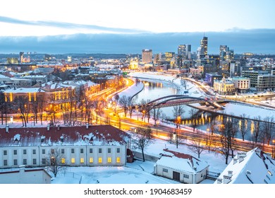 Vilnius, capital of Lithuania, beautiful scenic aerial panorama of modern business financial district architecture buildings with river and bridge in winter, Global City of the Future
