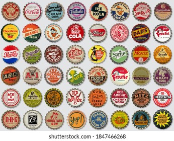 VILNIUS, LILTHUANIA - OCTOBER 18, 2020: Collection Of Old Used Vintage Soda And Beer Bottle Caps On Gray Background 