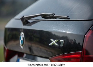 VILNIUS, LITHUANIA - AUGUST 10, 2020: BMW X1 2012 Year Compact Sport Utility Vehicle. Black Color. Closeup X1 Sign