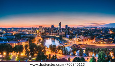 Vilnius, Lithuania, Eastern Europe. Modern Office Buildings Skyscrapers In Business District New City Center Shnipishkes In Night Illuminations. Panoramic View Cityscape At Sunset.