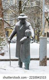 Vilnius, Lithuania - February 16 2022: Zemach Shabad Bronze Statue Taking Care Of A Girl And Her Kitty, Doctor And Vilnius Society Figure Of The First Half Of The 20th Century Covered By The Snow