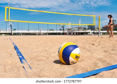 Vilnius, Lithuania - July 3 2020: Beach volley, ball on the sand and girl and net on background