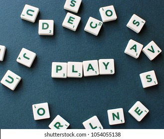 Vilnius, Lithuania, March 22, 2018: Scrabble Game Tiles Spelling Word Play On Green Background.