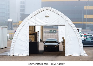 Vilnius, Lithuania - November 10 2020: Mobile Testing Station Tent, Hot Spot For Swab Test During Coronavirus Or COVID19 Outbreak With Paramedic And Car