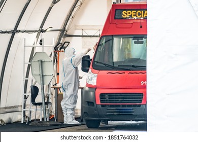 Vilnius, Lithuania - November 10 2020: Mobile Testing Station Tent, Hot Spot For Swab Test During Coronavirus Or COVID19 Outbreak With Paramedic And Special Bus