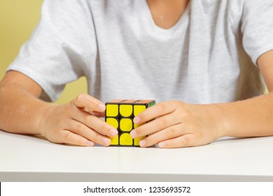 Vilnius, Lithuania - November 12, 2018: Kid Playing With Rubik Cube