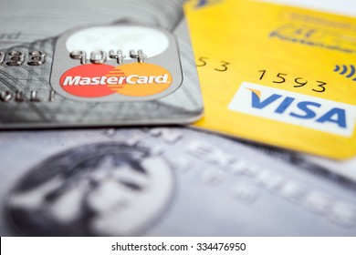 Vilnius, Lithuania - October 30, 2015: Closeup studio shot of credit and debit cards issued by American Express, VISA and MasterCard