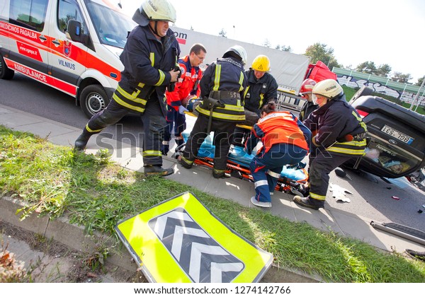 Vilnius/Lithuania May 6,\
2015 \
Paramedics are preparing an injured person for the transport\
to the nearby\
hospital