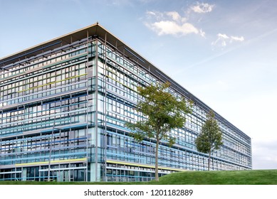 Vimercate, Lombardy, Italy - October 8 2018 : Large high rise modern office building with trees in foreground inside Energy Park area - Shutterstock ID 1201182889