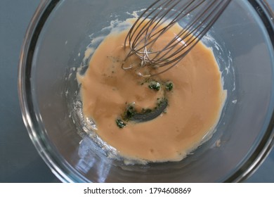 Vinaigrette With Green Chlorophyl And Whisk