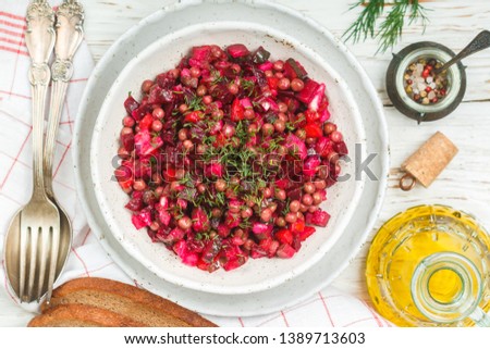 Traditional Russian salad in bowl. Olivier salad isolated