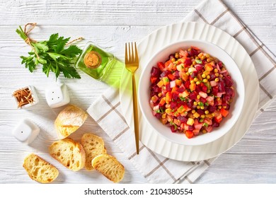 Vinegret, Russian Vinaigrette, Salad Of Diced Cooked Vegetables Red Beets, Potatoes, Carrots, Chopped Onions, Brined Pickles, Green Peas In A White Bowl On A White Wooden Table, Flat Lay