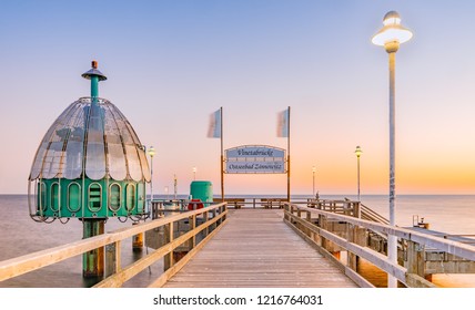 Vineta bridge Baltic Zinnowitz and diving bell on the island osf Usedom - Translation of the text on the sign: "Vineta bridge" "Baltic Sea bath Zinnowitz" - Shutterstock ID 1216764031