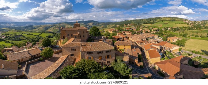 Rhône Vineyard. View of the Saint-Mathieu de Oingt Church and the village with the vine field and countryside around