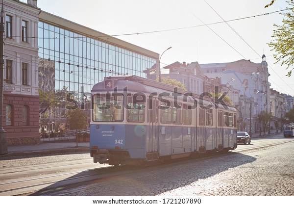 VINNYTSIA, UKRAINE - APRIL 29, 2020: \
View of\
Soborna Street with a blue Tram in the center of Vinnytsia.\
\
Public transport in the city in Ukraine, located on banks of\
Southern Bug river