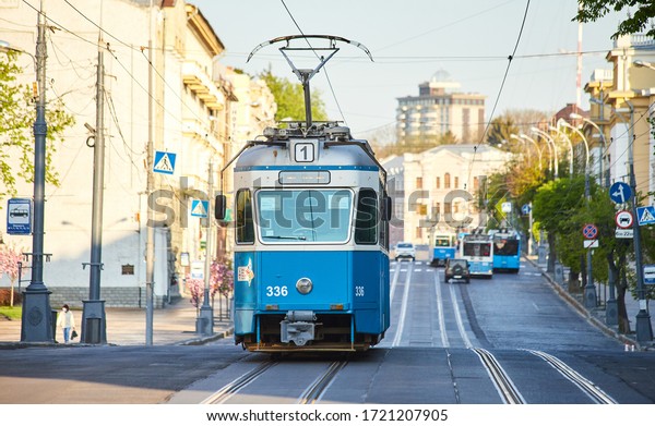 VINNYTSIA, UKRAINE - APRIL 29, 2020: \
View of\
Soborna Street with a blue Tram in the center of Vinnytsia.\
\
Public transport in the city in Ukraine, located on banks of\
Southern Bug river